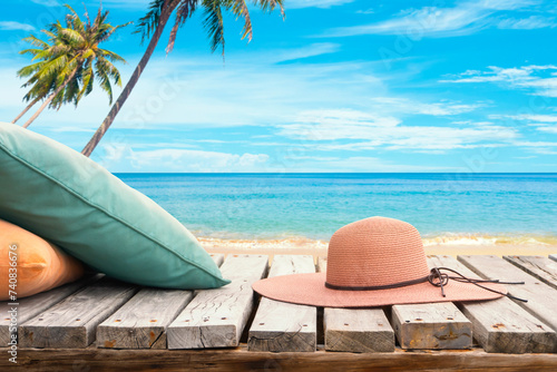 Photography Tropical beach with wide brim hat and pillow, relax at summer holiday background
