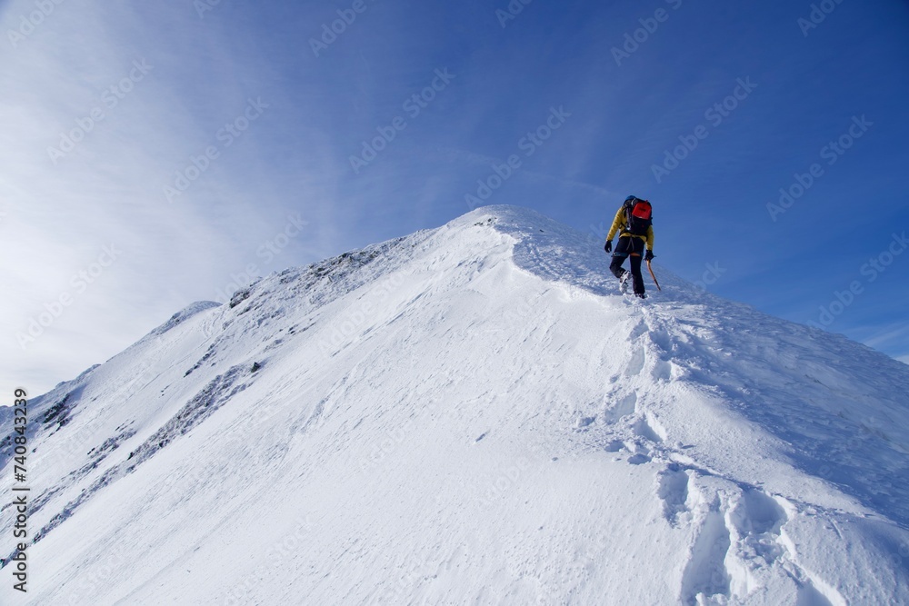 skier on the top of mountain, Vaiuga Peak, Fagaras Mountains, Romania