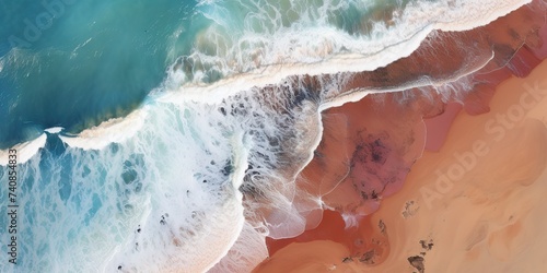 Aerial top view drom drone of a beautiful coastside waves sea ocean beach sand and surface. Relaxing vacation tourism deocrative promotion background scene