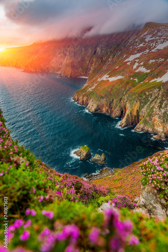Slieve League or Slieve Liag - A dramatic landscape photo featuring the Slieve League,  The mountain on the Atlantic coast of County Donegal, Ireland. One of the highest sea cliffs in Europe. photo