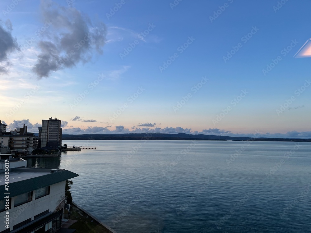 Naklejka premium 海の日没風景