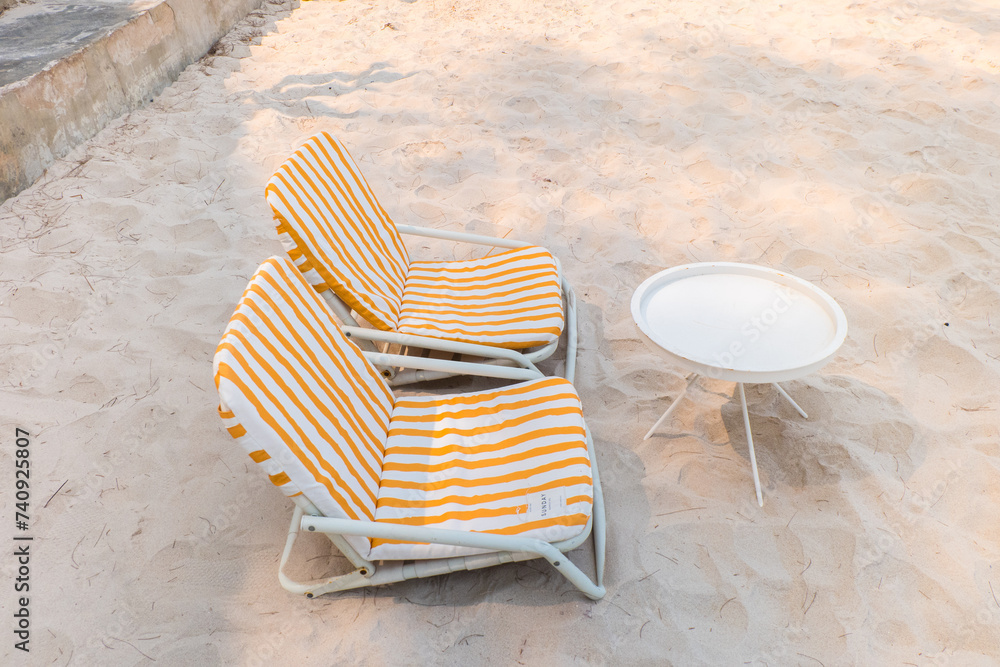Beach chair on white sand in summer. Beach chair on white sand in summer.