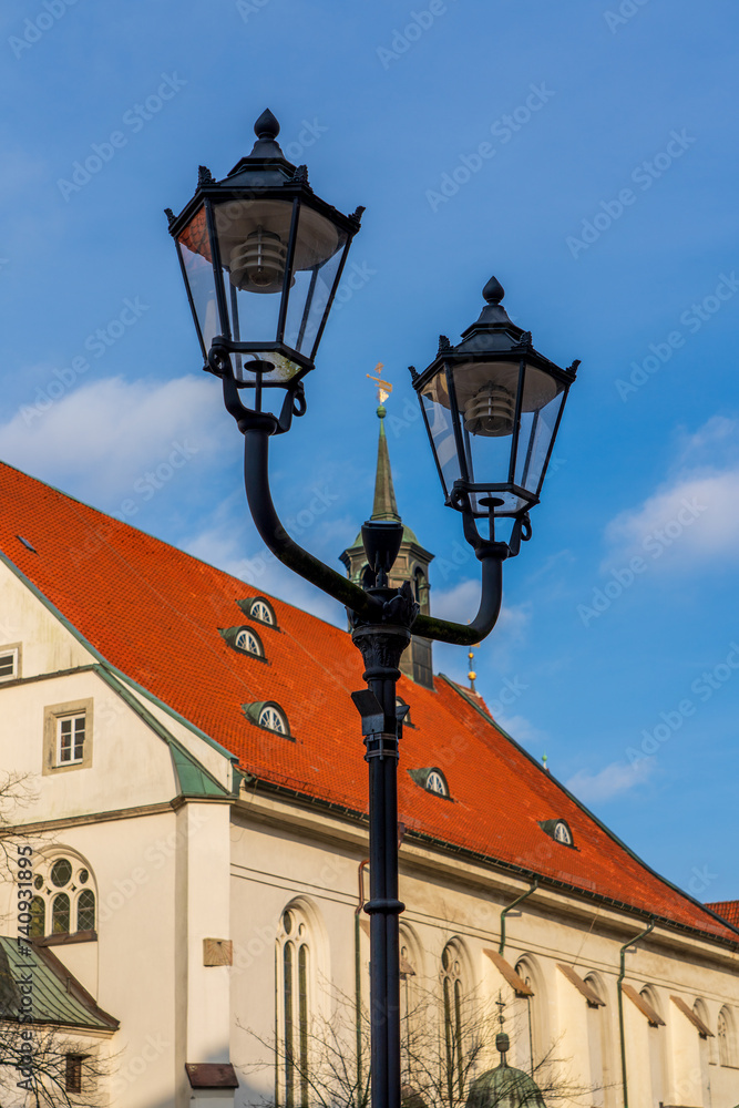 Street lamp in front of the church in Celle in Germany.