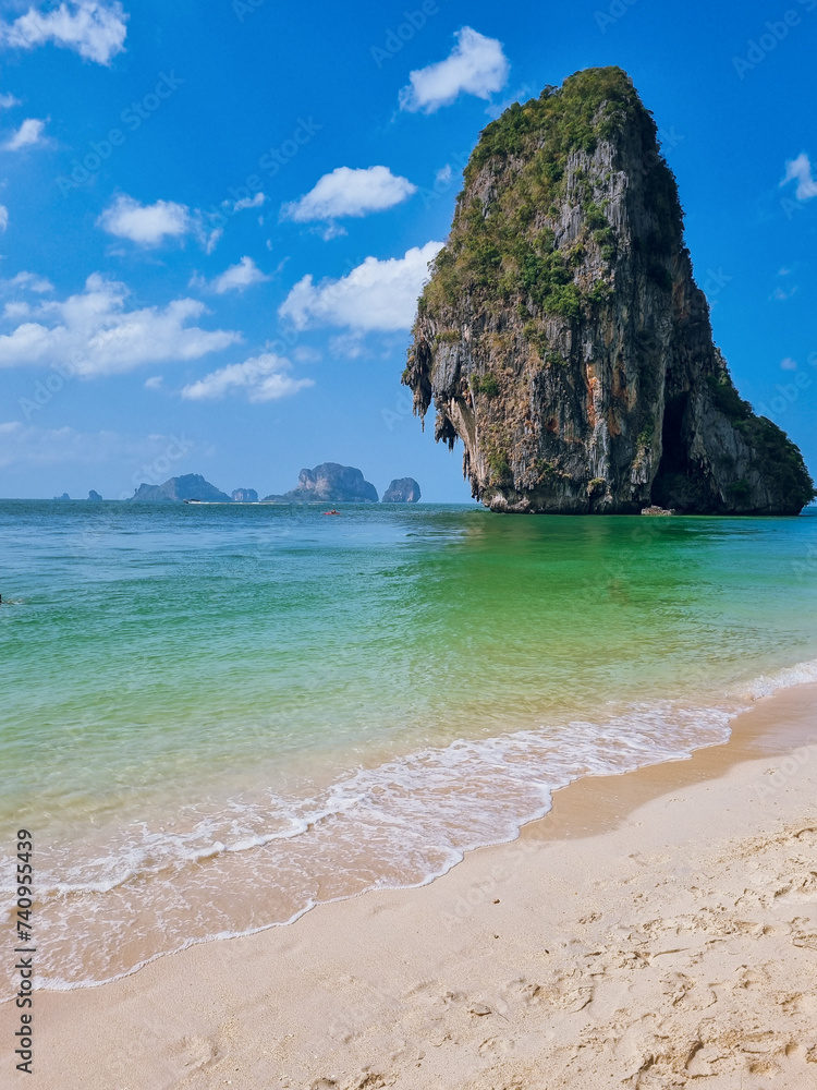 PhraNang Cave Beach with crystal blue waters and a limestone cliff in front, Krabi, Thailand