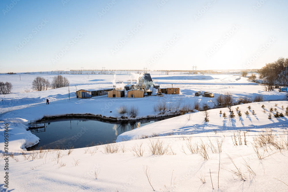 Heart-shaped mountain lake, winter landscape, sunset, beautiful nature of the Ural Mountains, blue lake, thermal spring. Heart-shaped mountain lake, winter landscape, sunset, beautiful nature of the Ural Mountains, blue lake, thermal spring.