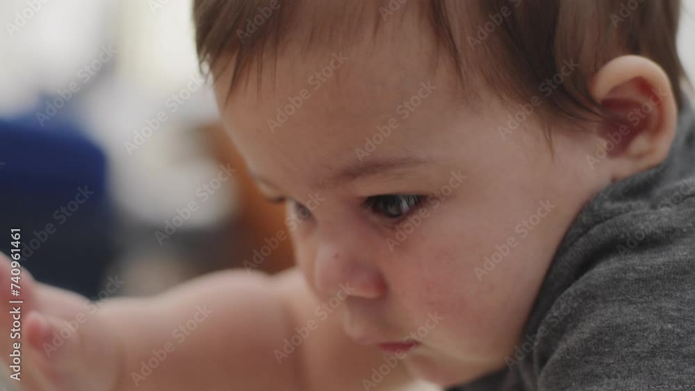 Closeup shot of a baby boy playing with a colorful toy Closeup shot of a baby boy playing with a colorful toy