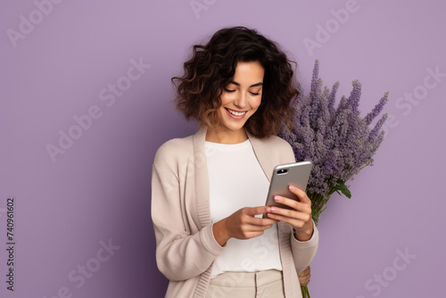 Happy woman with phone on Lavender studio background
