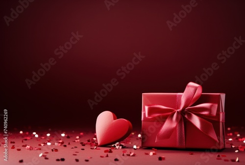 two red presents and hearts on a red background
