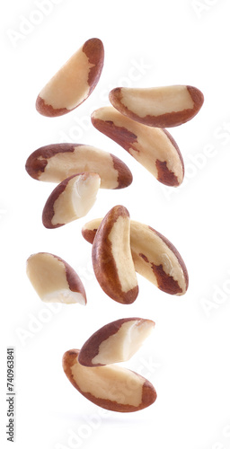 Brazil nuts flying on white background