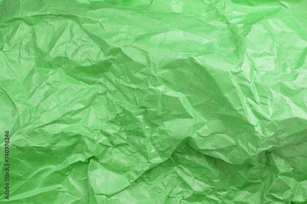 Fototapeta premium Сrumpled paper texture green. Texture of crumpled paper. Crumpled paper. Wrinkles paper.