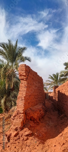 Old houses made of stone and red clay, a village in the middle of the desert with its typical Saharan architecture in the oasis of Timimoun, Algeria
