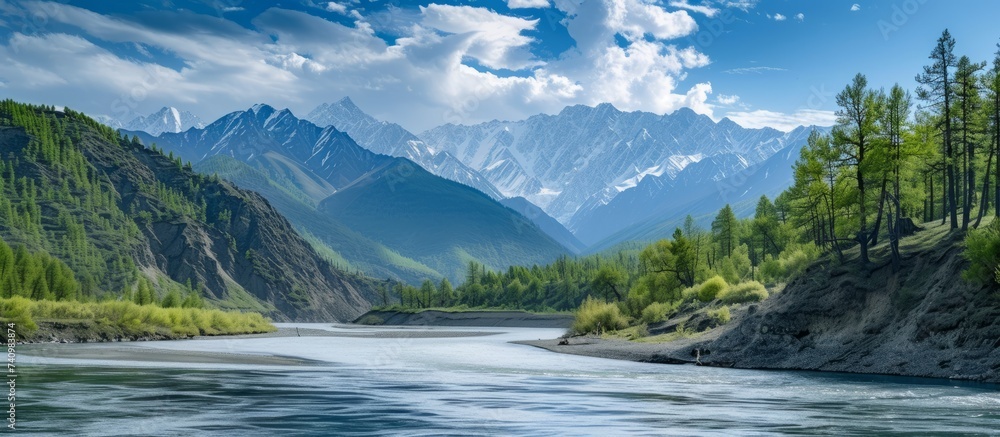 A picturesque river flowing through majestic mountains surrounded by lush greenery