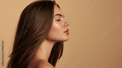 A serene image of a woman with her eyes closed, presenting a natural and peaceful demeanor. The shot captures a moment of tranquility and beauty, ideal for themes of wellness and mindfulness.