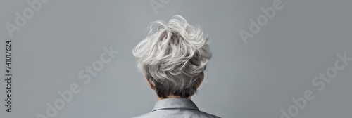 Rear view of a girl with short haircut gray hair, care and hair care concept, banner