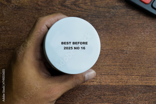Close up text best before date on bottle cap food