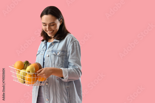Young woman with basket of ...