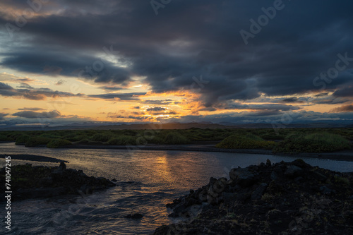 Sunset over moss fields in Iceland. Scenery, travel banner © piksik
