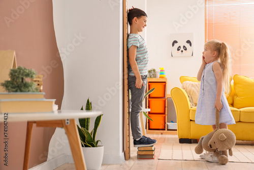 Cute little kids measuring ...