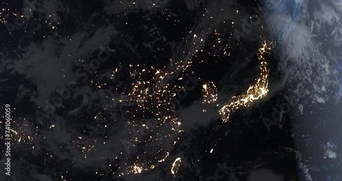 The onset of new daylight over East Asia. Satellite view of Japan, Korea and China from space. 3D animation of the Earth globe 4K. Contains NASA images. photo