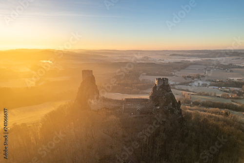 Trosky medieval castle ruins at cold morning sunrise time. Bohemian Paradise, Czech: Cesky raj, Czechia. Aerial view from above. photo