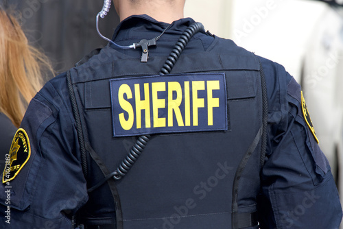 Close up on Sheriff title logo on back of flack jacket.