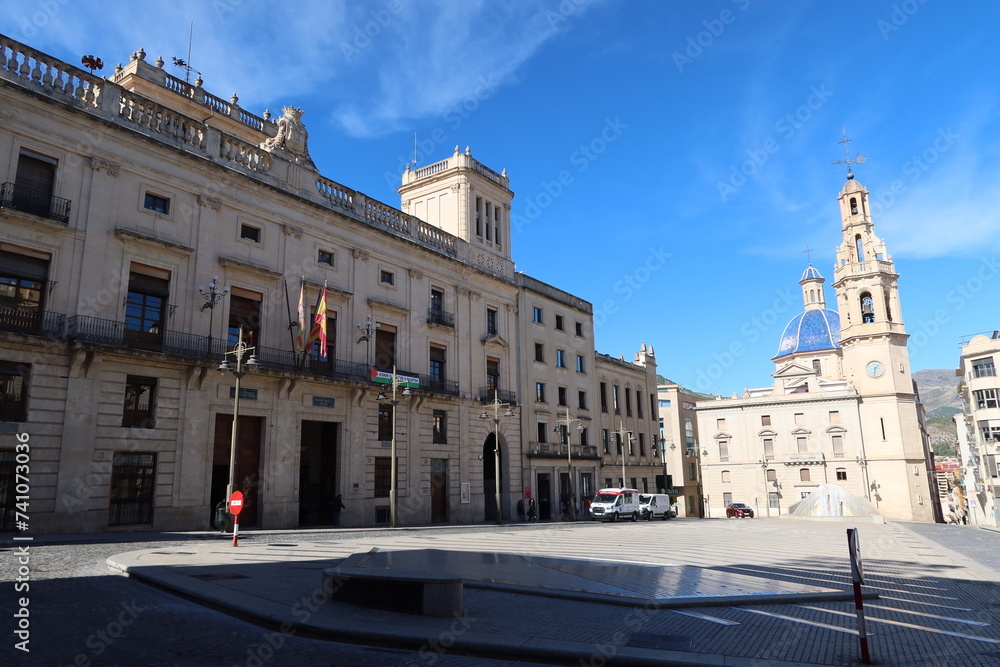 Alcoy, Alicante, Spain, February 20, 2024: Parish of Santa Maria on the right and Town Hall on the left. Alcoy, Alicante, Spain