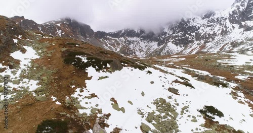 High altitude aerial drone shot of Satania dolinka hiking area revealing Hincovo pleso lakes in High Tatras mountains photo