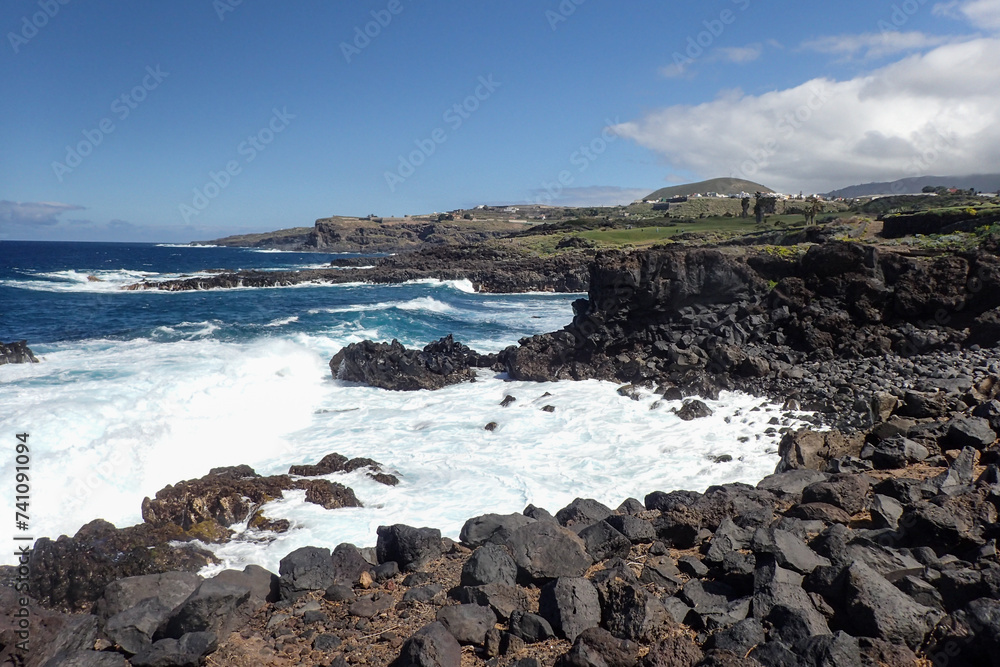 Buenavista del Norte, coastal panorama with path at the edge of the ocean Buenavista del Norte, coastal panorama with path at the edge of the ocean