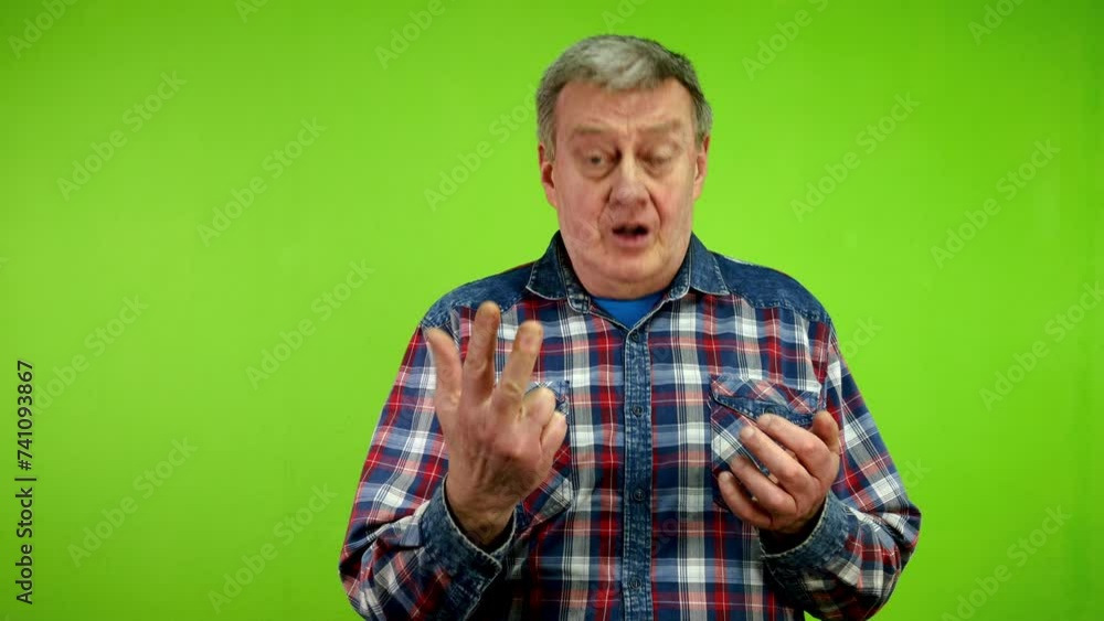Senior man counting from one to four with fingers and explains something. Senior man counting from one to four with fingers and explains something.