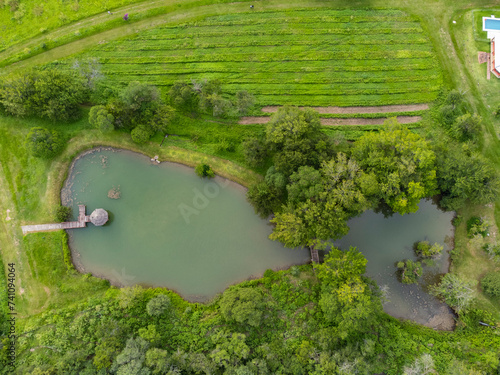 Vista aerea desde un drone del lago en un campo en la merced, catamarca, argentina photo