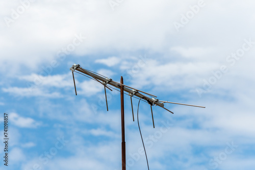 Old television antenna with the sky in the background. © arieldufey
