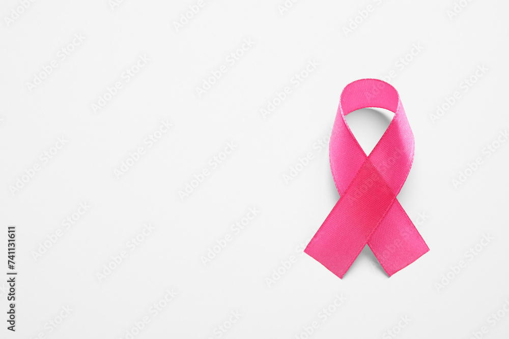 Pink ribbon on white background, top view and space for text. Breast cancer awareness Pink ribbon on white background, top view and space for text. Breast cancer awareness