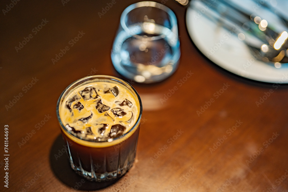 Americano, coffee shop, iced coffee, simple wooden table, glass cup, brown, green background, Americano, coffee shop, iced coffee, simple wooden table, glass cup, brown, green background,