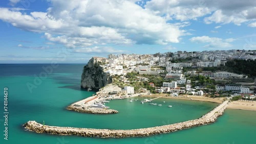 The town of Peschici and its marina in Europe, Italy, Puglia, towards Foggia, in summer, on a sunny day. photo