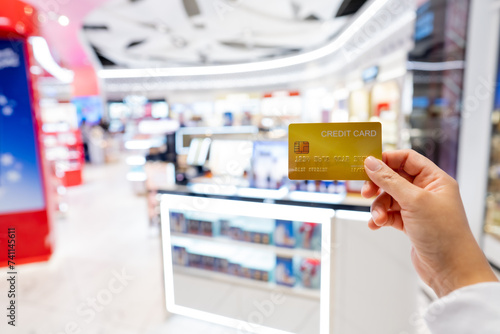 Travel, Tourist woman showing credit card or travel card for convenient travel Make shopping easy enjoy lifestyle travel city at shopping street on holiday vacation in Japan