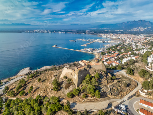 Luxury single family and apartment vacation houses surround Trinity Fort in Roses Spain with deep blue sea and sky photo