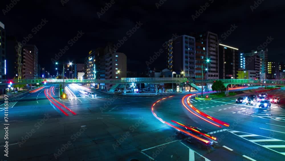 A night timelapse of traffic jam at the large crossing in Kyoto wide shot zoom