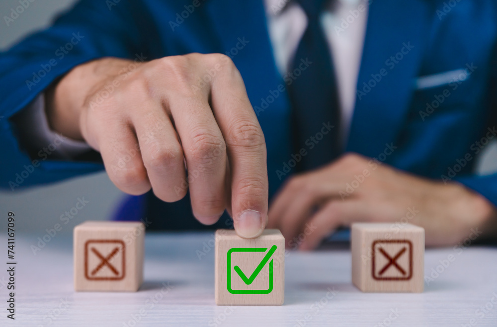 Checklist concept, business person checklist tick answer sign in checkbox, validation online questionnaire quality control document, man use pen to tick correct sign mark in checkbox form.
