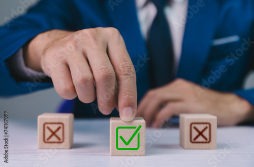 Obraz na płótnie Checklist concept, business person checklist tick answer sign in checkbox, validation online questionnaire quality control document, man use pen to tick correct sign mark in checkbox form. w salonie