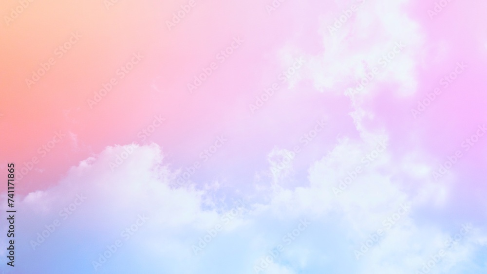 The background of the combination  of faded gradients of pink, yellow, orange, blue and purple.  and the softness of the white mist clouds in the gentle atmosphere.