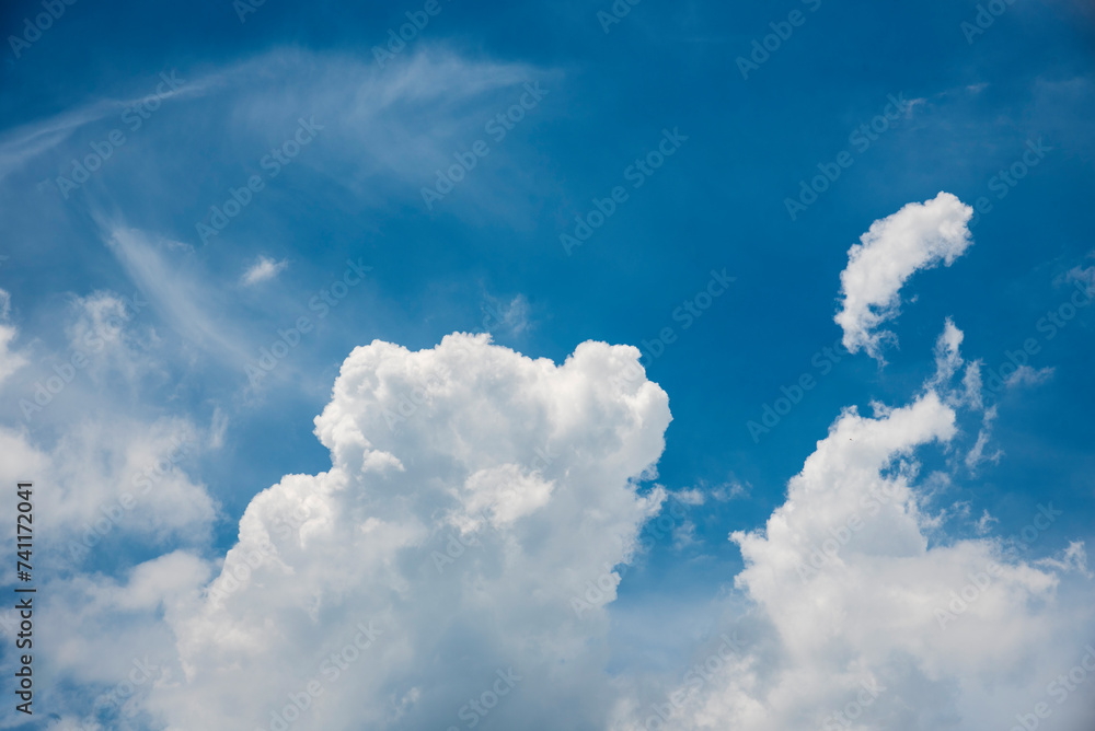 Blue sky fluffy white clouds on summer season bright clear skyline with ...