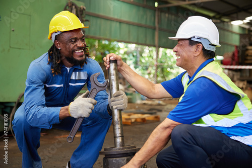 workers or engineers enjoy working and having fun in the factory