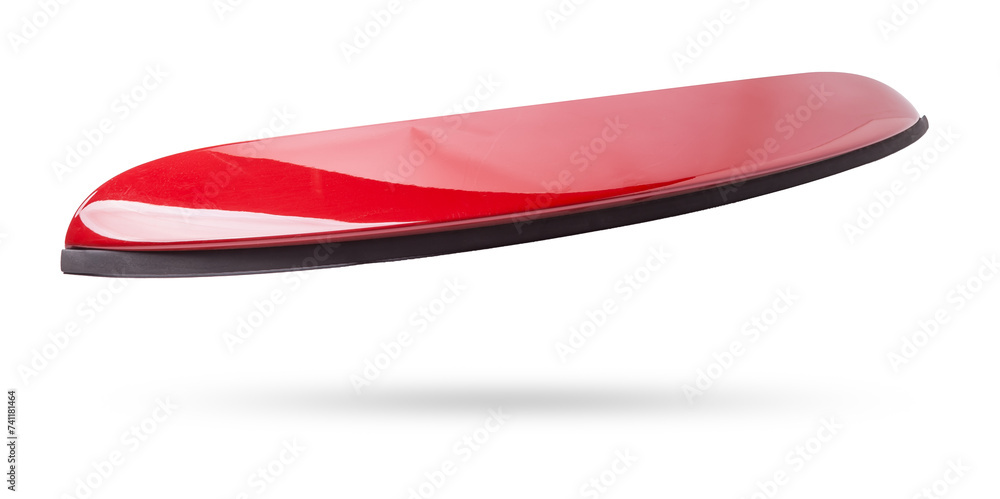 Red sports style spoiler for installation on the trunk lid on a white isolated background in a photo studio in a car repair shop for sale at an auto-parsing.