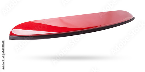 Red sports style spoiler for installation on the trunk lid on a white isolated background in a photo studio in a car repair shop for sale at an auto-parsing.