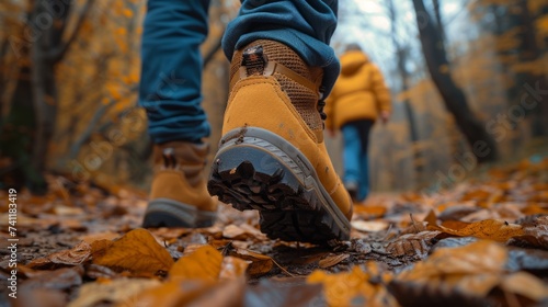 Close-up rear of shoes children and adults walking on the trail during autumn. Detail on hiker shoe rear view. copy space for text. AI