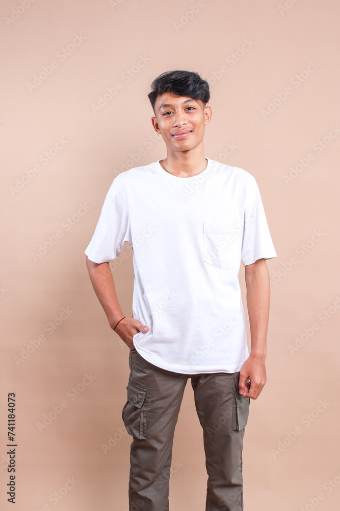 Portrait of Young Asian Man in Casual Style Smiling Portrait of Young Asian Man in Casual Style Smiling