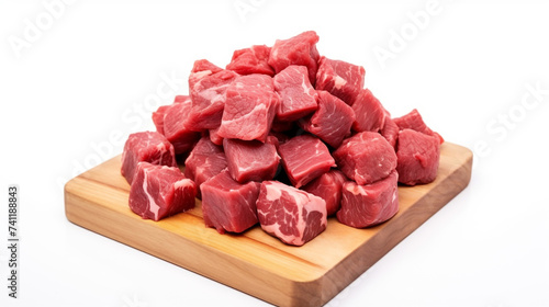 Raw beef meat chopped in cubes isolated on white background