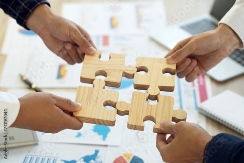 Concept of teamwork and partnership. Business teamwork puts the jigsaws team together cooperation unity concept represents team support and help. Charity, volunteer. Unity, team business.