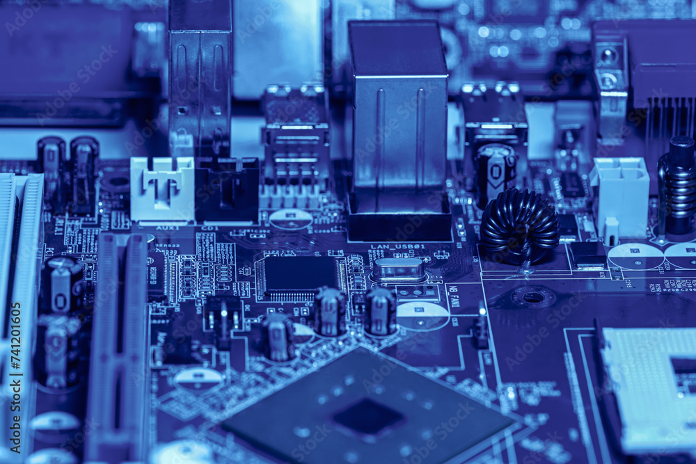 electronic components and microchips on computer circuit board. extreme closeup. electronic components and microchips on computer circuit board. extreme closeup.