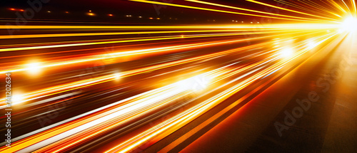 Blurred motion on the highway, streaks of light under the night sky, capturing the essence of speed and travel